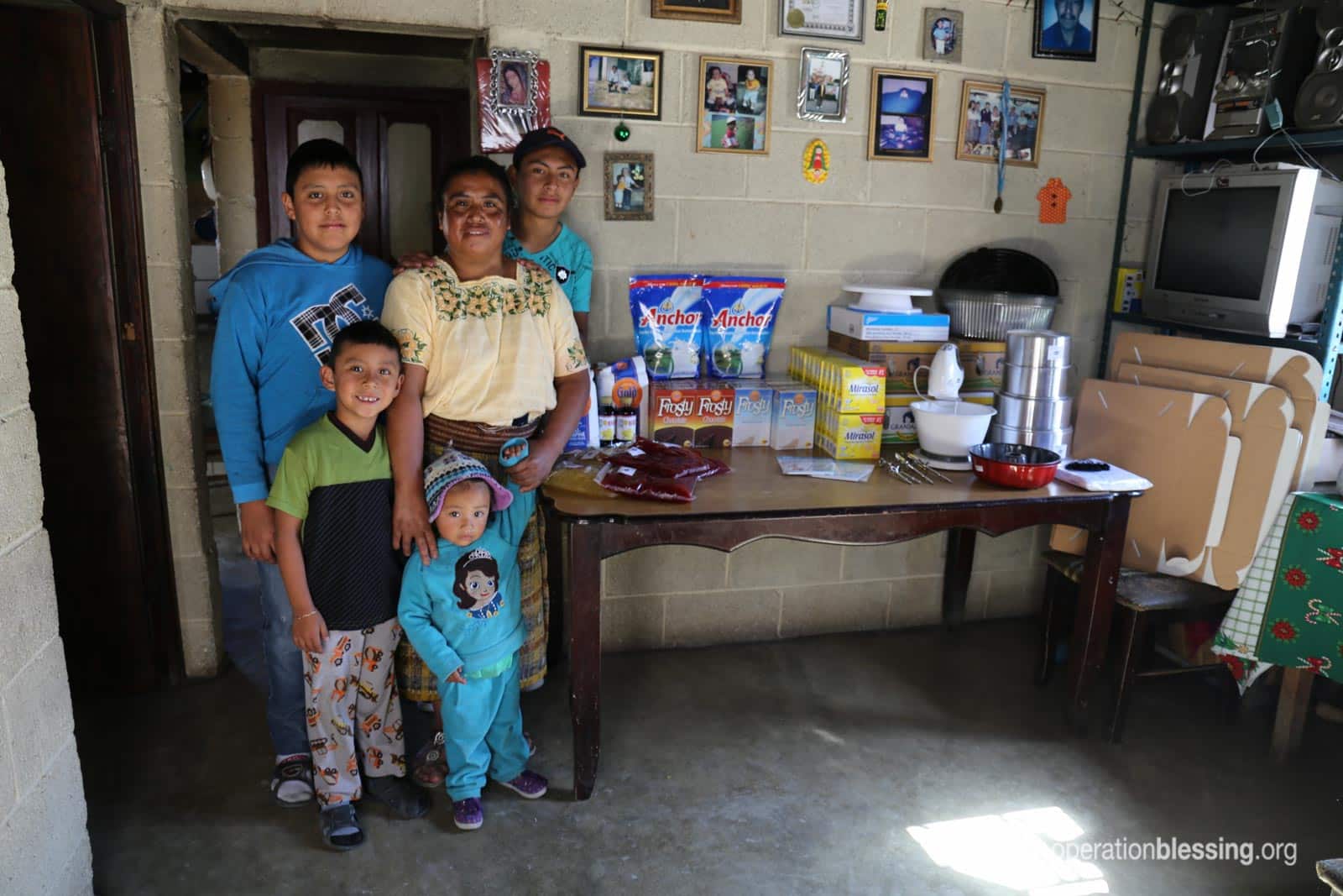 Miriam standing with her family.