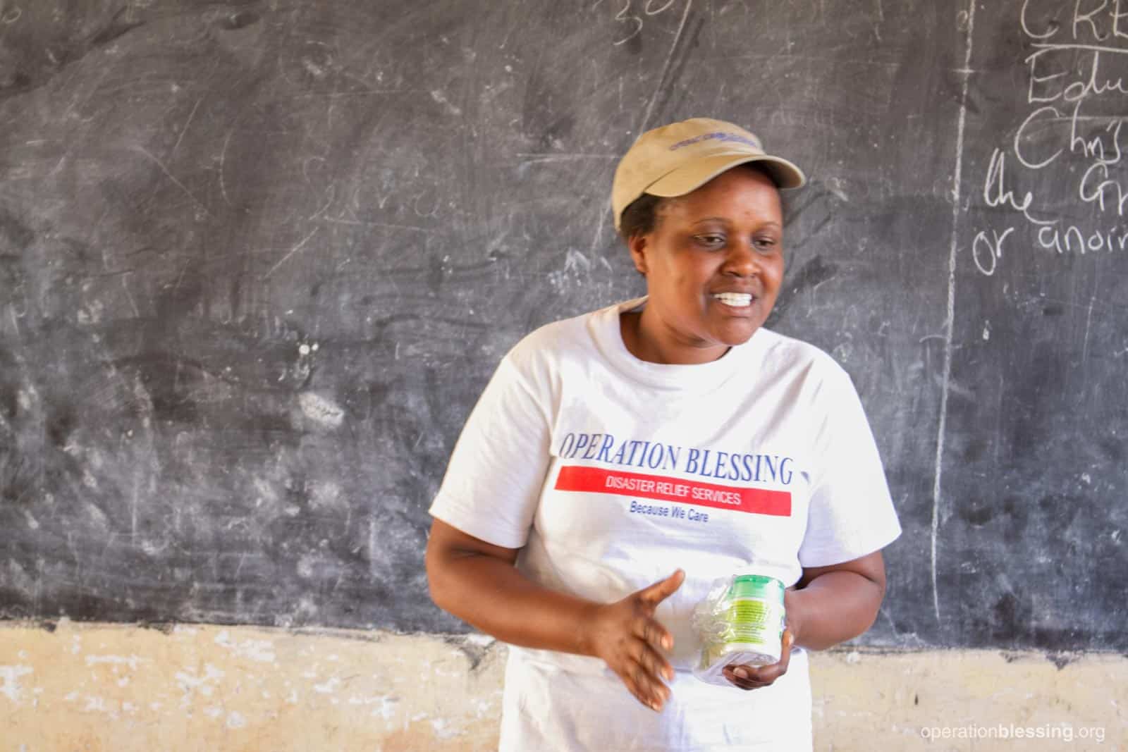 An OB worker teaching villagers in Kenya about fighting malaria. 