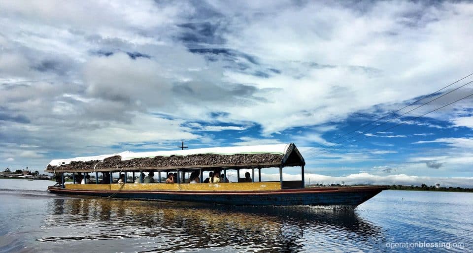 Boats are used to deliver aid along the river in Peru.