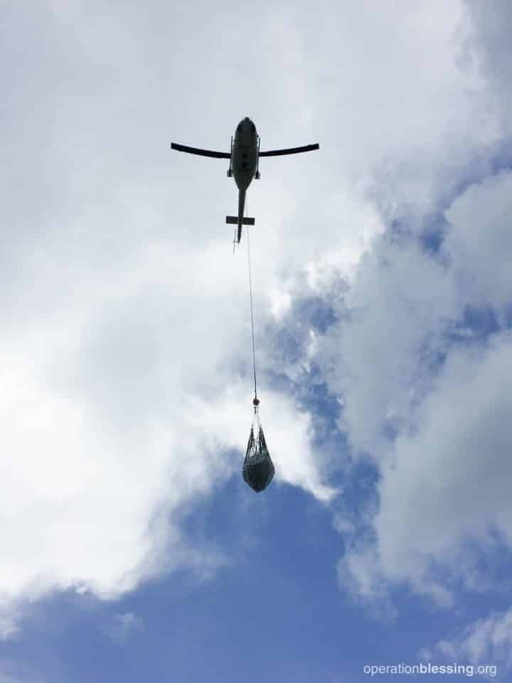 Air lifting aid to Haiti after a hurricane.