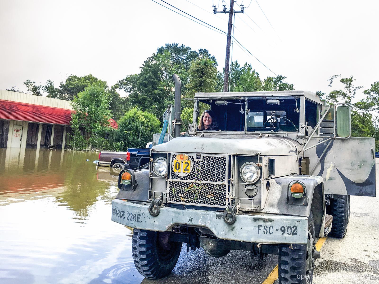 Using an army truck to reach flood victims.