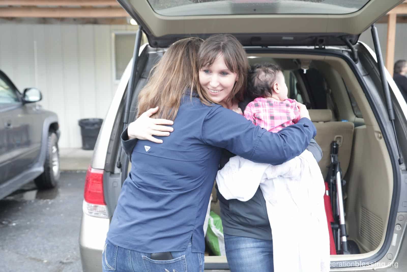 Lakashah receives a hug and help from Operation Blessing.