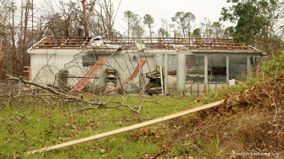 The damage to a building on Marie and Gene's property.