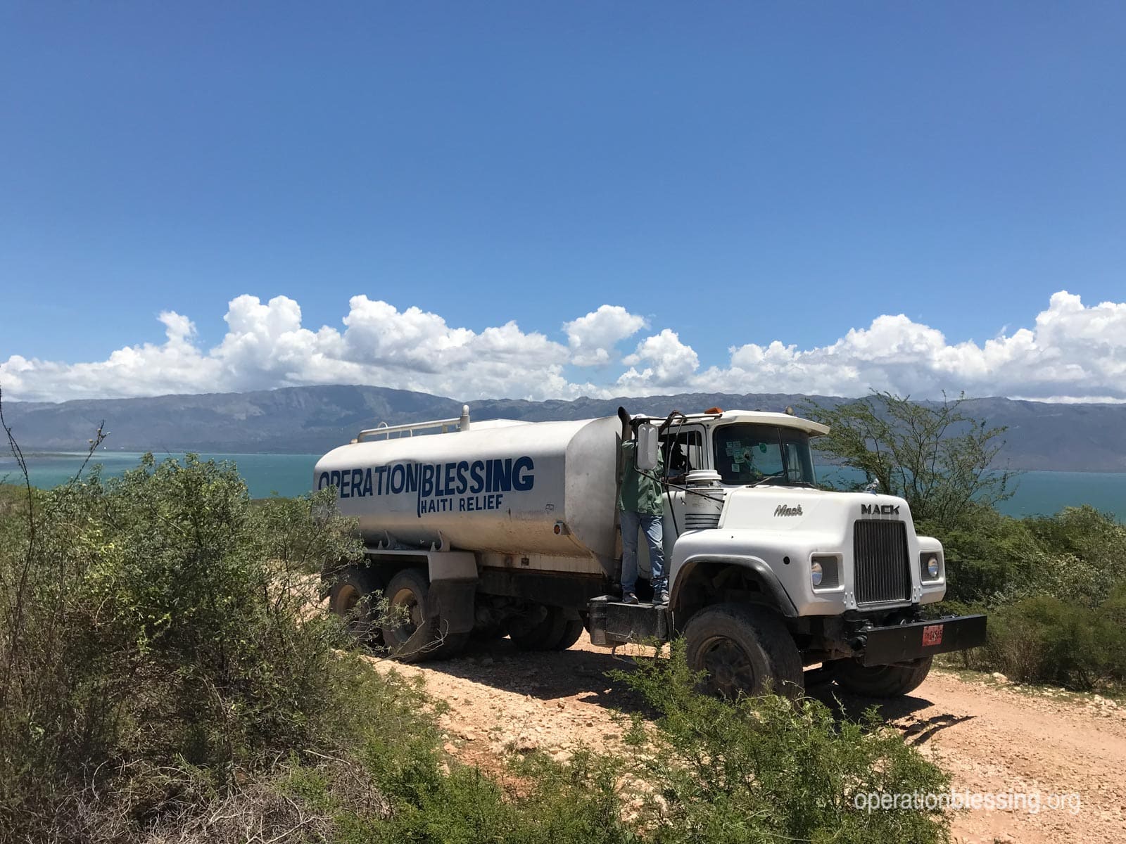 A truck making a delivery of safe water supplies.