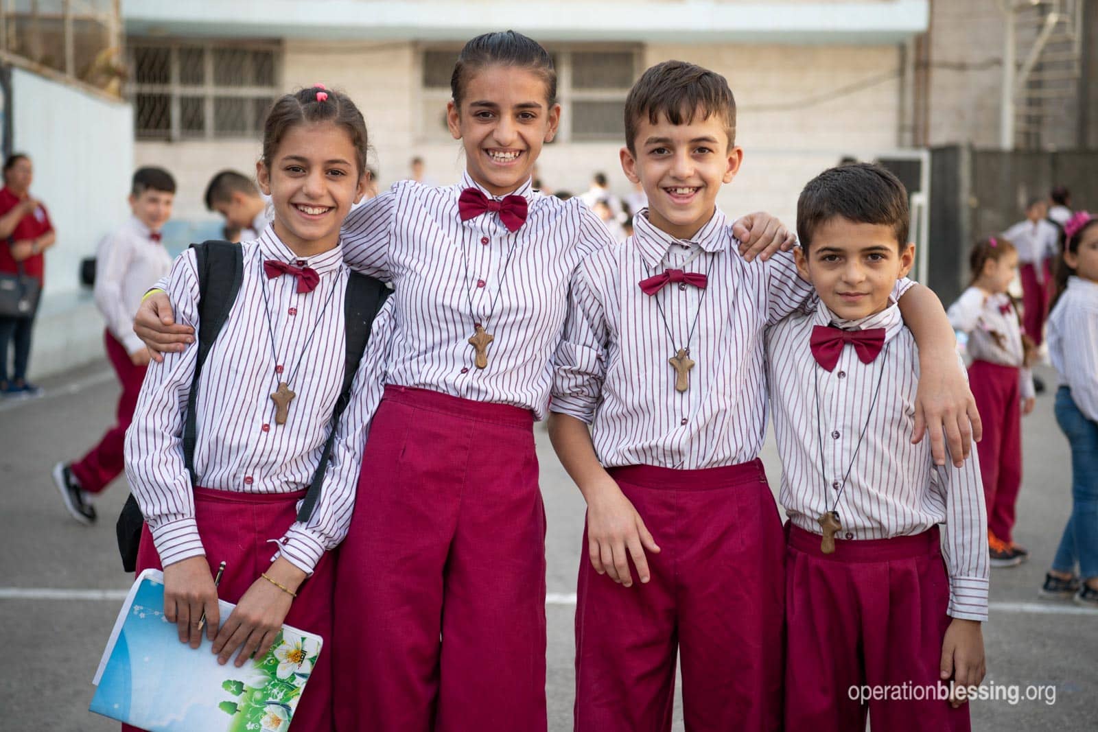 Wisam's children dressed in uniforms for school - part of their new life in a new land.