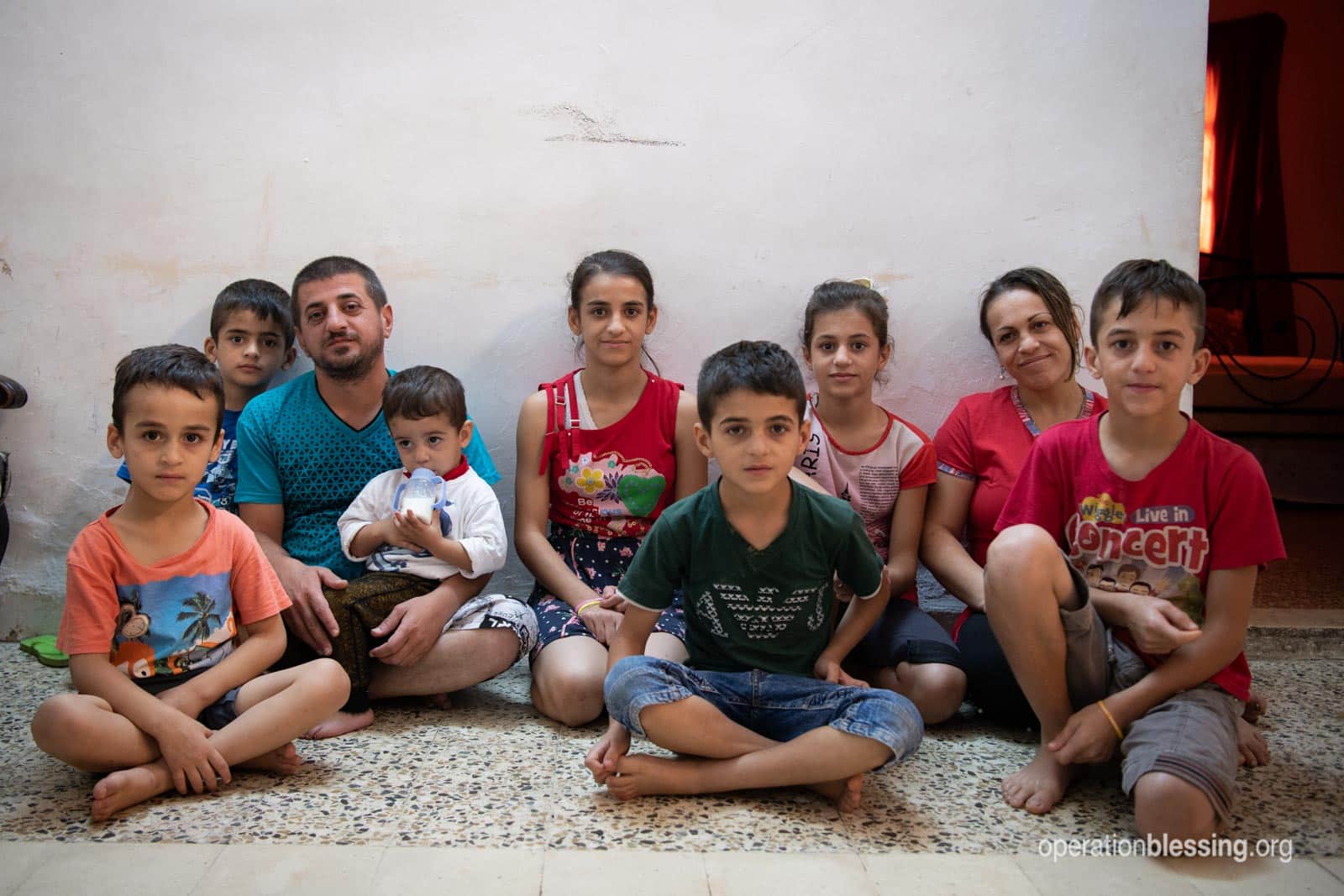 Wisam with his wife and family - persecuted Christians who fled Iraq for a new life in a new land.