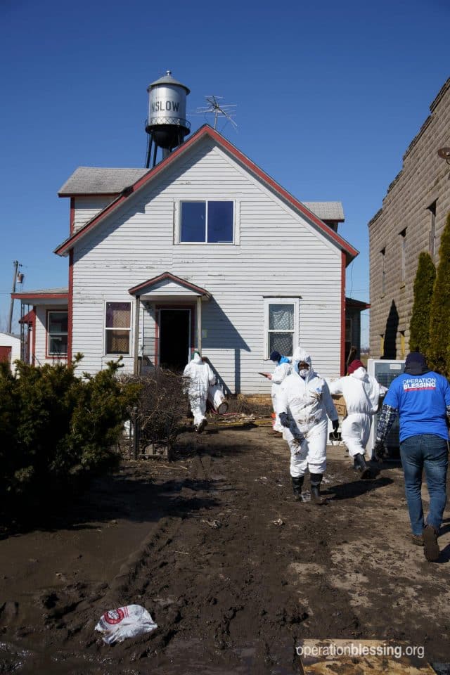 OB staff and volunteers work to clean out a flood damaged home in Winslow, Nebraska. 