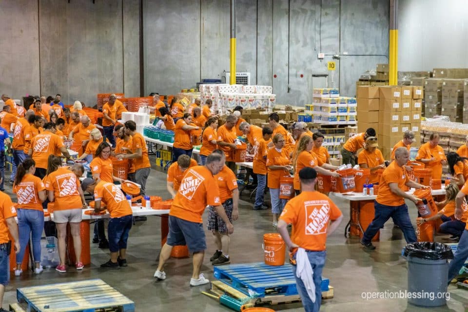 Volunteers racing to pack supplies.