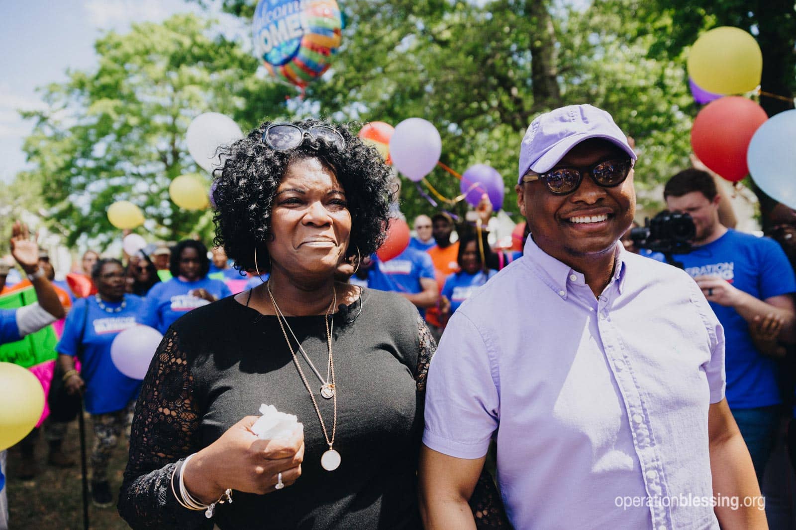 Divya and Terry are emotional as they approach their newly renovated home.