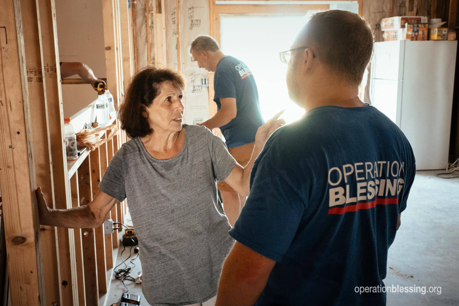 Ms. Peterson talking with Operation Blessing volunteers.