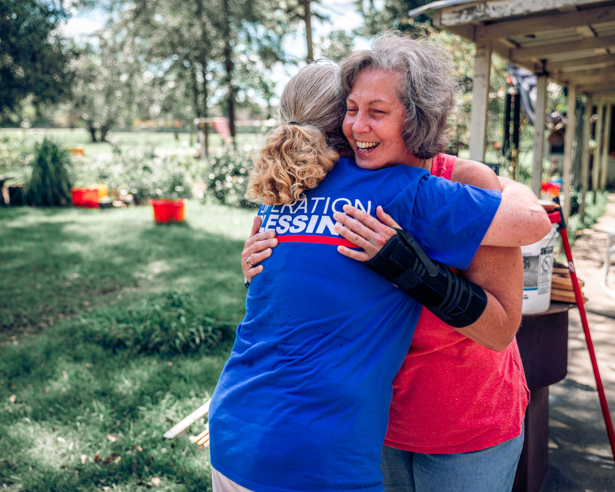 Blessings have come back to Brenda as she gets disaster relief help and a hug.