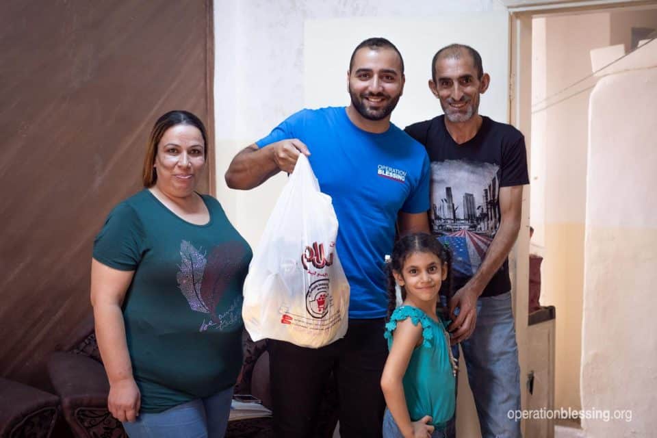 Maryam's family receives food from Operation Blessing.