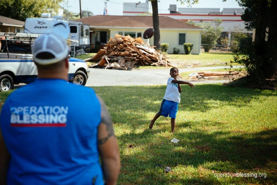 An OB worker plays with and encourages Debra's grandson.