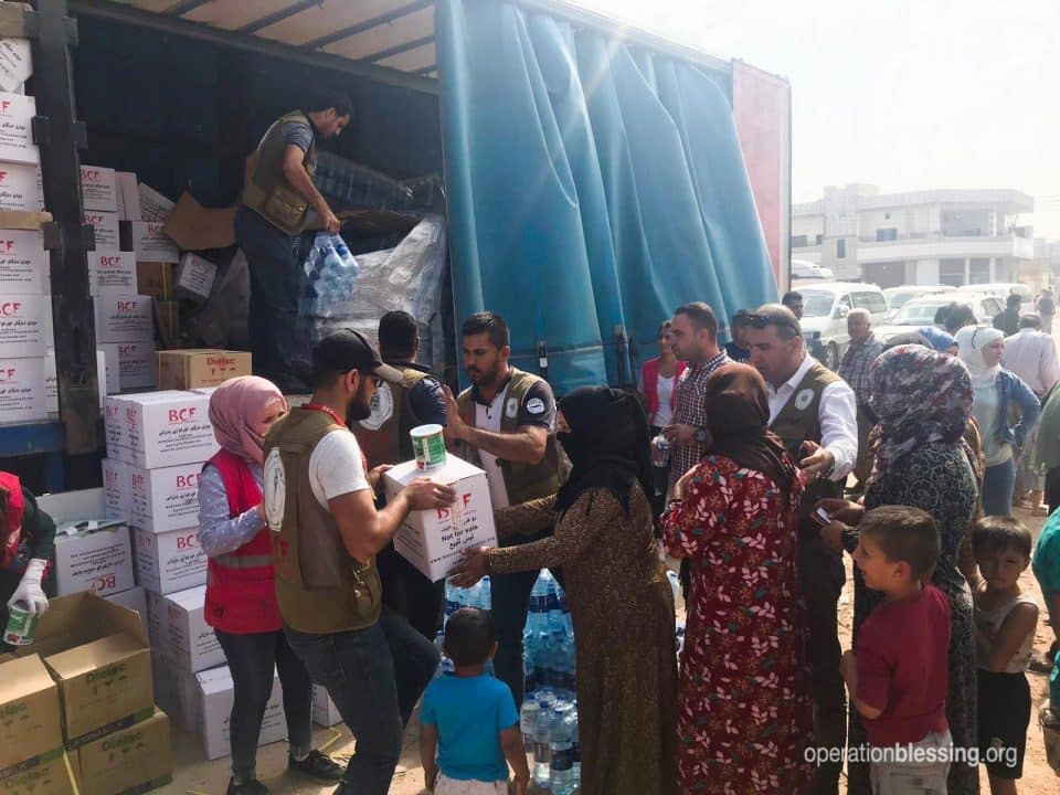 Distributing aid packages to Kurdish and Syrian refugees.