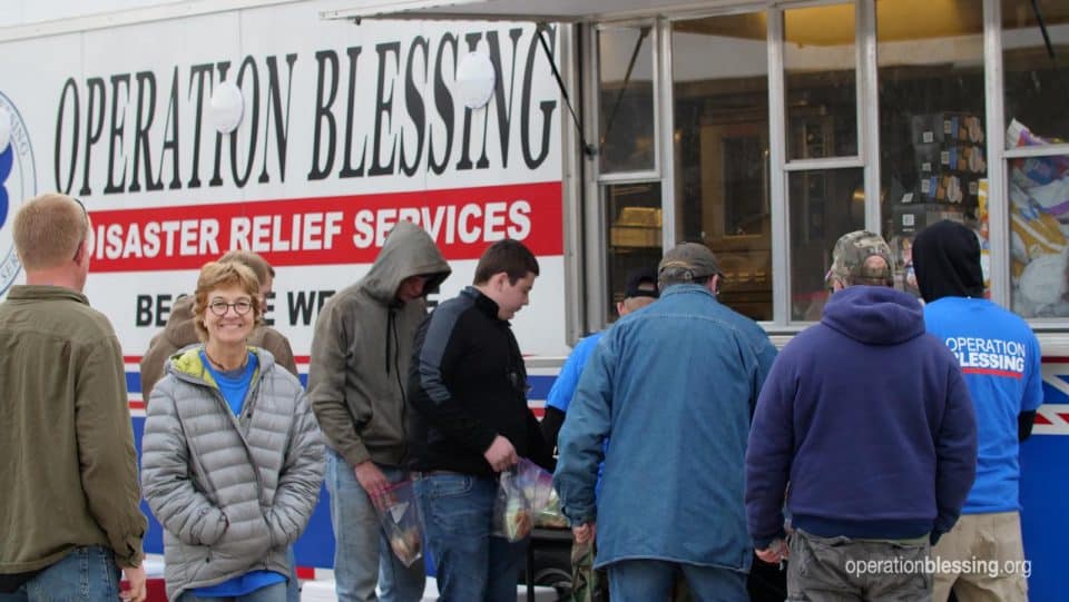 Serving hot meals to disaster victims from our mobile kitchen.