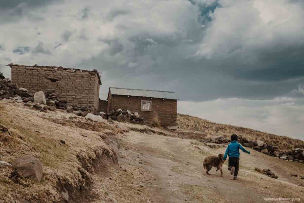 boy happily running after medical care in peru