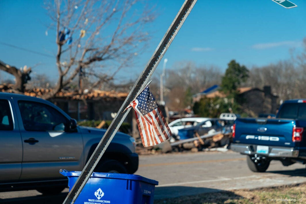 America flag in middle of Kentucky tornado damage in December 2021