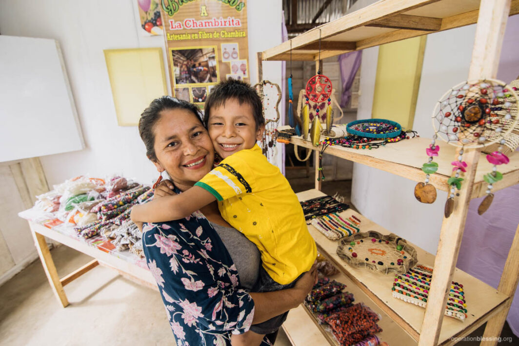 Gisella and son in new home workshop