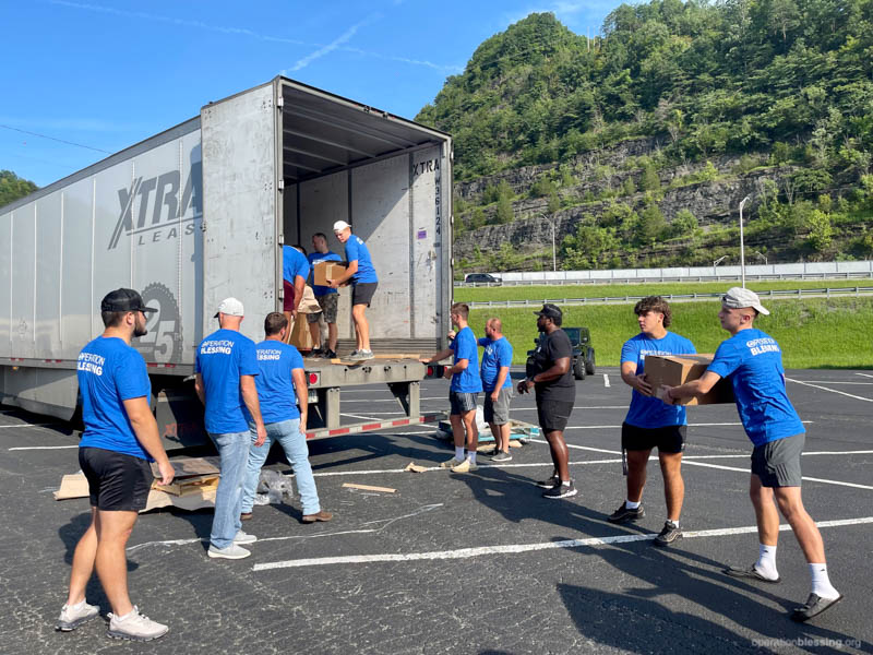 Unpacking emergency meal kits for Kentucky flood relief. 