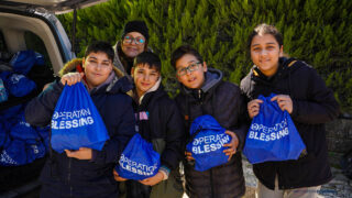 Kids being blessed after Turkey earthquakes.