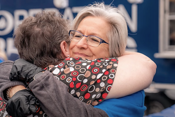 disaster volunteer giving a hug